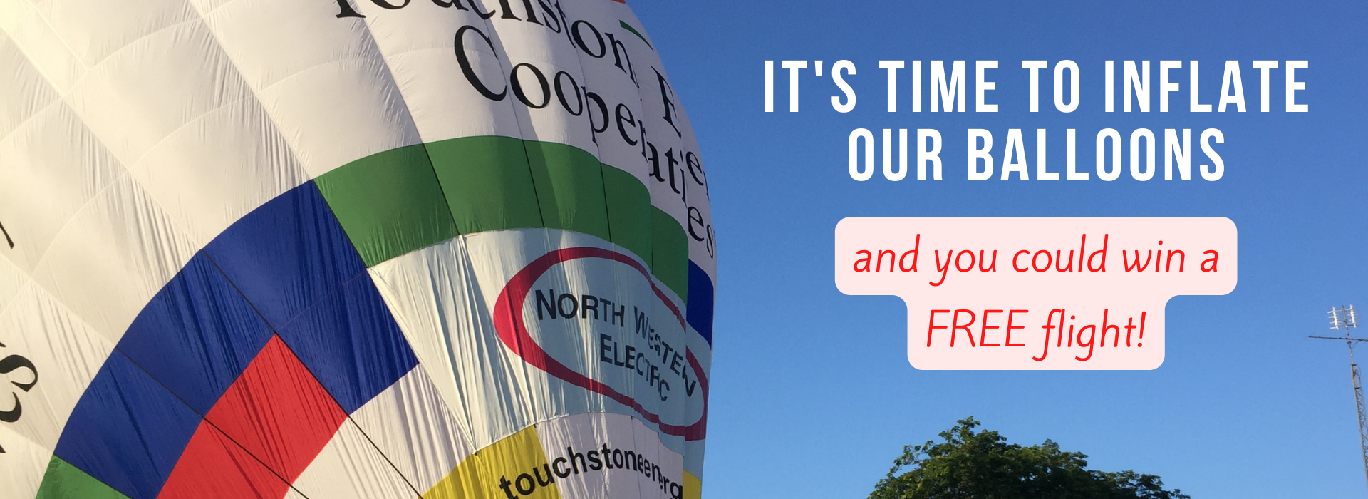 hot air balloon inflating with sky in background